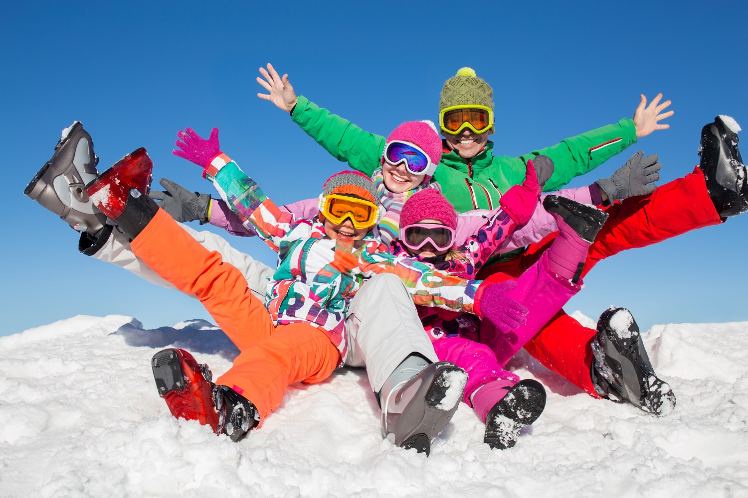 happy family in winter clothes enjoy on the snow at ski resort