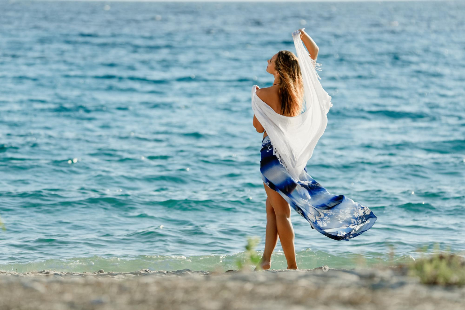 rear-view-beautiful-woman-with-shawl-enjoying-summer-freedom-by-sea